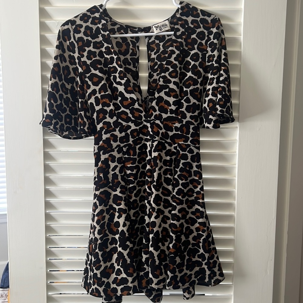 Show Me Your Mumu romper. Has a zipper on the side and ties in the back.
